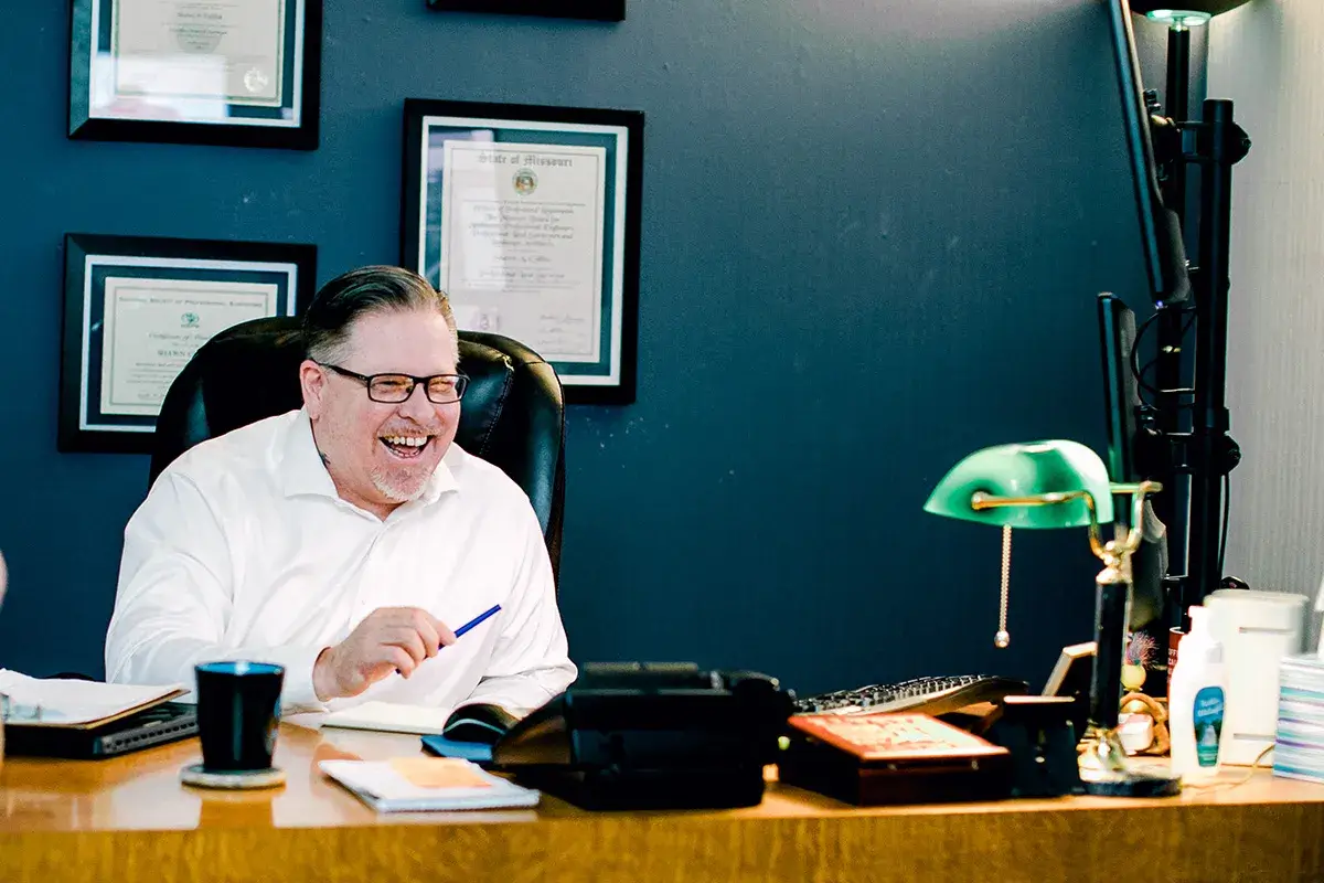 Shawn working at his desk